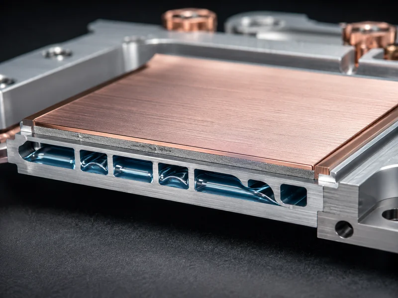 Cold plate contact interface for DLC cooling, a macro view of the flat mounting face, TIM layer, and internal coolant channels